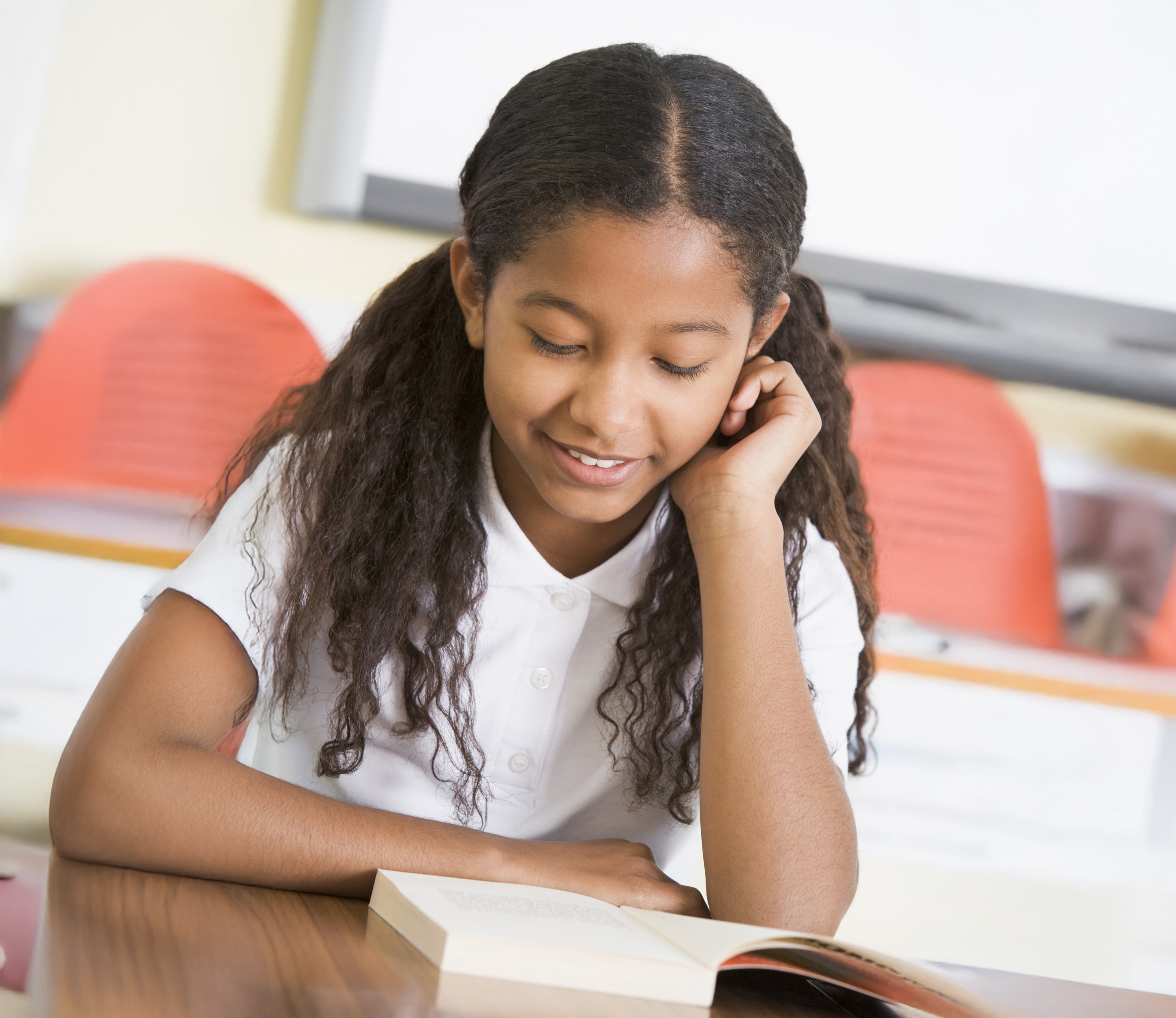7th grader girl reading a story